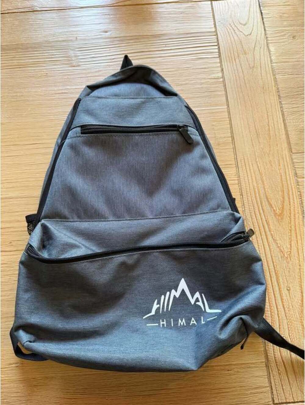 Gray Backpack for tennis rackets with Himal Logo